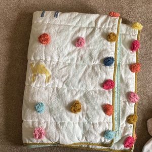 Anthropologie “beni” camel and pom pom child quilt